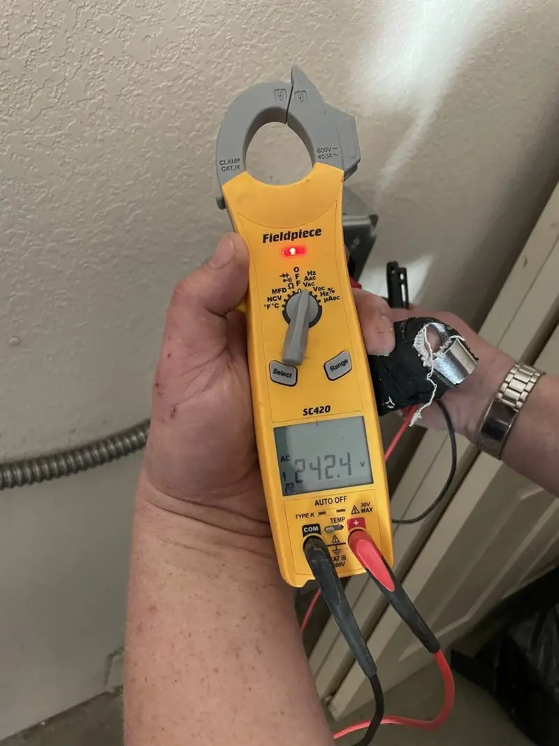 Voltage testing with clamp meter during Electrical Installation Services in Oshtemo